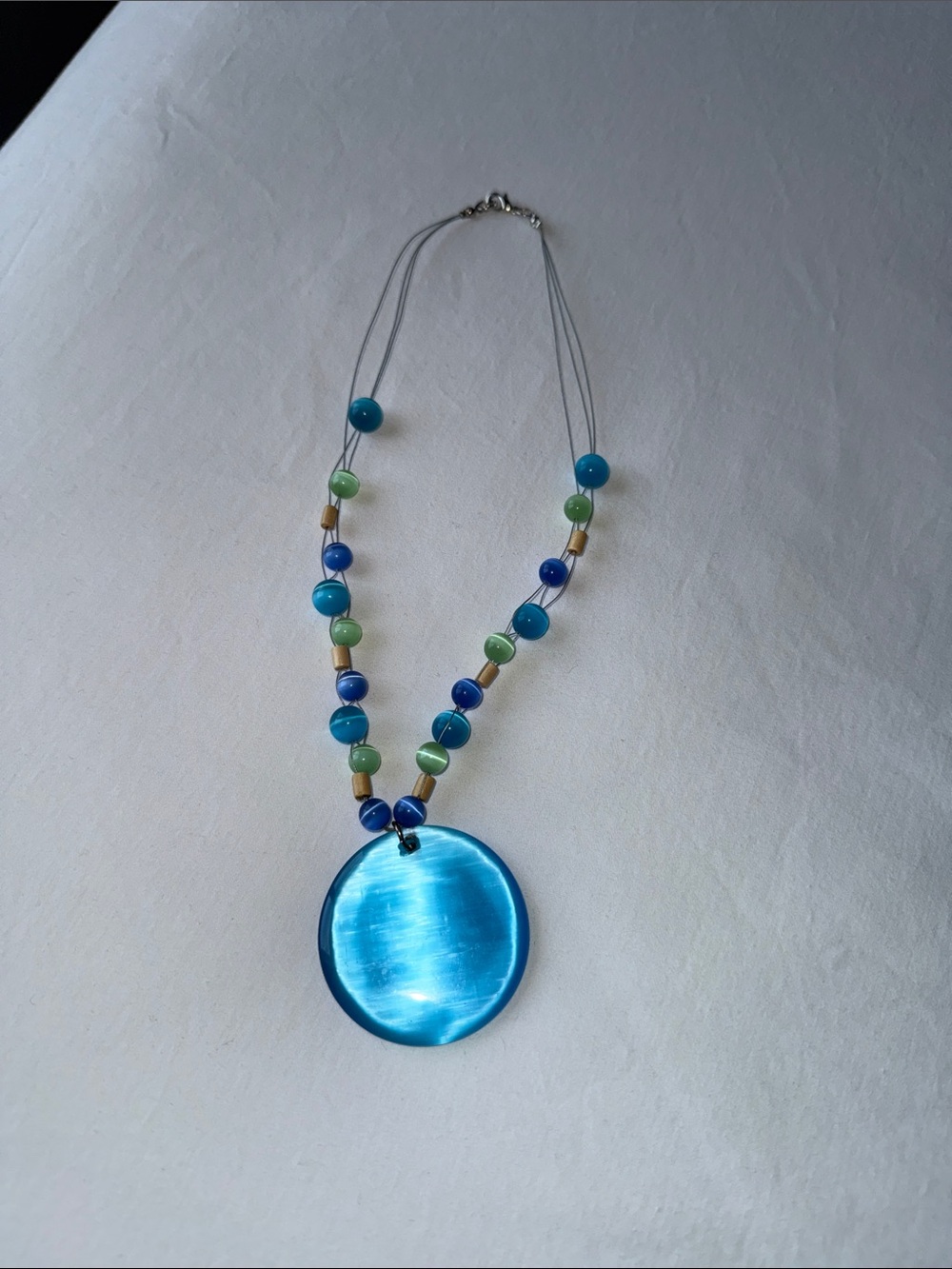 Blue Glass Disc Pendant Necklace with Beaded Accents